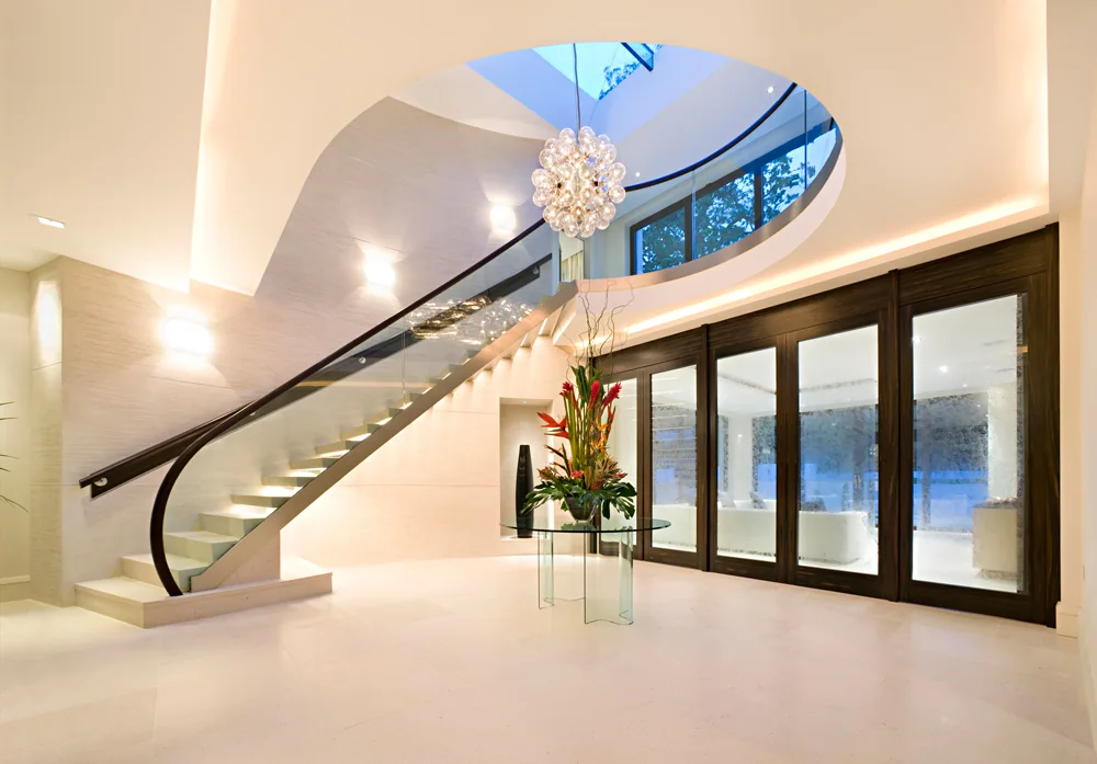 Contemporary entrance hall with architectural staircase lighting in completed BPE residential work